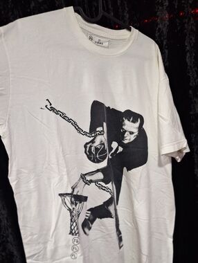 The shirt in the image features a stylized graphic of Frankenstein's monster pla